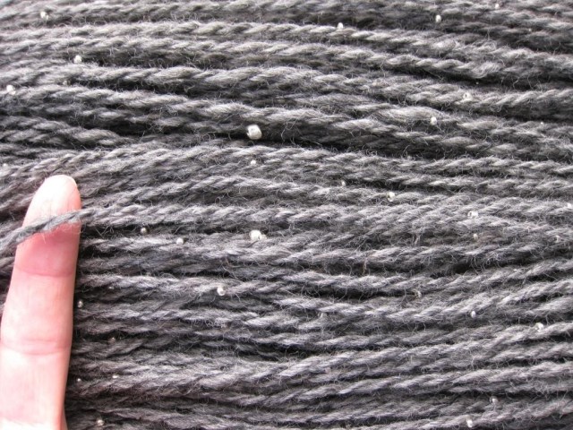 Beaded yarns require more hours for string the beads, and plying VERY slowly.